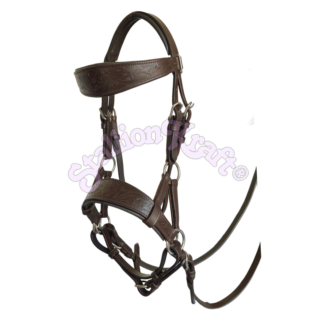 Brown oval sidepull bitless bridle handcrafted from full-grain genuine leather with hand-tooled floral detailing on the browband and noseband. Soft brown cowhide padding helps improve comfort, while stainless steel buckles and rings provide reliable performance.